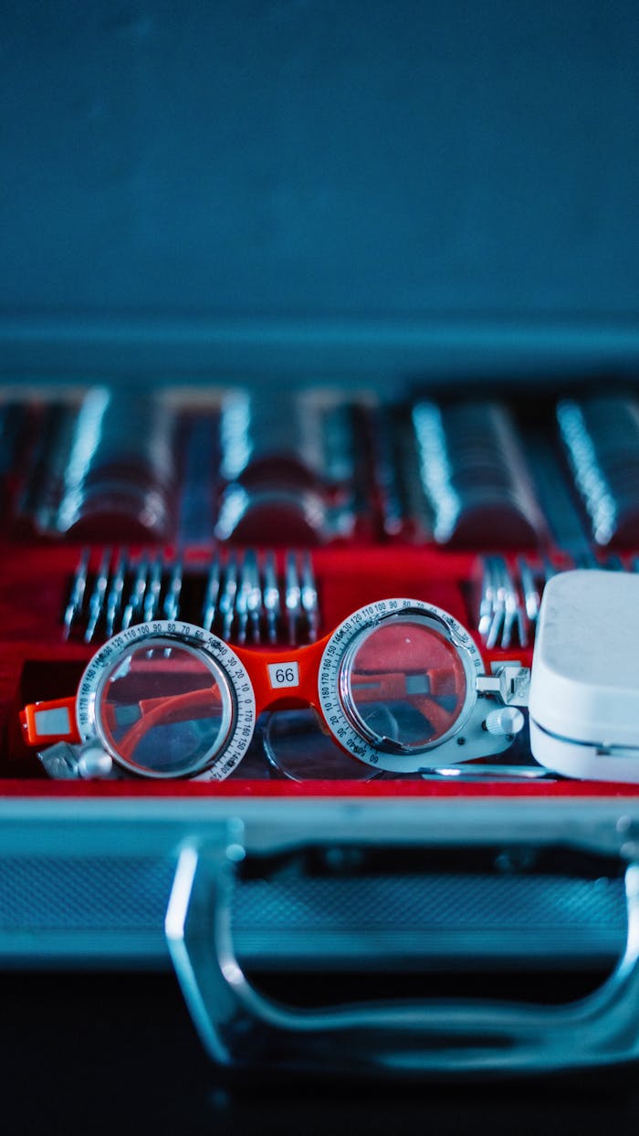 Close-up of an optometry trial lens set in a case for vision testing.